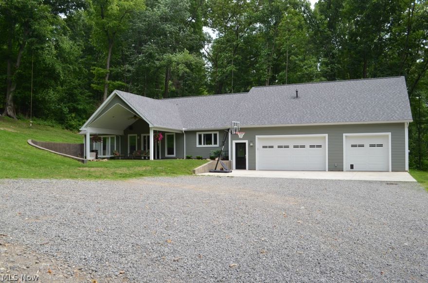 Transitional style home on 2 acres outside of Winesburg. Main floor features a chef's kitchen with commercial appliances and custom cabinetry. Open concept first floor with master suite, laundry, and large walk in pantry. The home has in-floor heat and forced air gas heat with C/A, central vac. Second floor features family room, 2 more bedrooms, bath, and a studio apartment complete with kitchen and full bath. 2x6 construction, blown in insulation, Anderson windows, wired for sound. Front porch is plumbed for outdoor grill. 40x44 Mechanics dream garage with in-floor heat, 11' ceiling, Jib crane, and built in workbench.