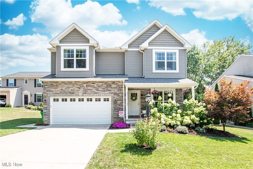 Welcome home to this beautifully maintained Colonial located in Fox Village which is in Brunswick Hills Township. This home features 4 bedrooms with 2 full & 2 half baths, plus a finished basement, giving this home a total of 2,927 sq ft of living space.  As you approach the entrance, notice the inviting front porch.  Once inside, you step into the bright living room.  Lovely LVT flows throughout the living room, hallway, half bath, kitchen & dining area.  The large eat-in kitchen is ahead and was recently updated in 2024 with new quartz countertops, a tile backsplash, a new range & new faucet/sink.  There is a breakfast bar & ample counter & cabinet space.  Plus, all stainless steel appliances are included!  The dining area is off the kitchen with access to the deck & backyard, making it easy to dine inside or out.  Open to the kitchen is the large, bright family room with a lovely gas fireplace.  Completing the main floor is a half bath. Upstairs, you will find the spacious master bedroom with a vaulted ceiling & a large walk-in closet.  The master bath features a double vanity, a large walk-in shower & a jetted soaking tub. Three additional nice-sized bedrooms, all with ample closet space & another full bath, complete the upstairs. Plus, for added convenience, the laundry is located upstairs as well - washer & dryer (2022) are included.  The basement was refinished in 2024 and offers 792 sq ft of additional living space with an egress window for added safety.  A half bath was also added & there is additional storage space available.  A radon mitigation system was installed in 2019.  Outside, you will find a nice-sized deck and a wooded backyard for additional privacy.  There is a large attached two-car garage. This home is conveniently located between Brunswick & Medina, making it easy to access all the many amenities both cities offer.  This great home is move-in ready and just waiting for new homeowners.