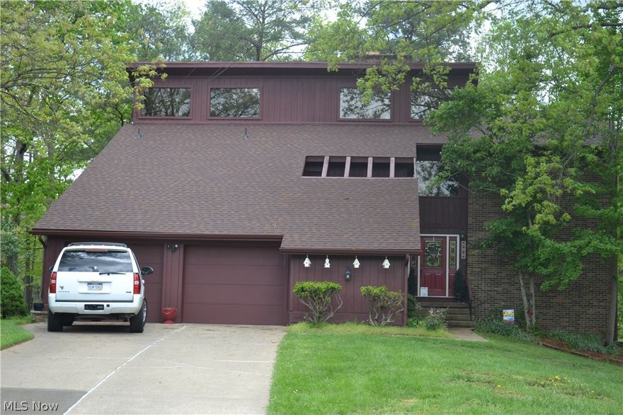 Beautiful contemporary home in a park like setting! This home has decks perfect for summertime entertaining and great views. The home is filled with natural light. Enjoy formal living and dining rooms, family room, kitchen with breakfast nook and 4 bedrooms which feature their own private bath. The 2-stall garage has a bonus workshop area. Windsor Estates offers a community pool and tennis courts!