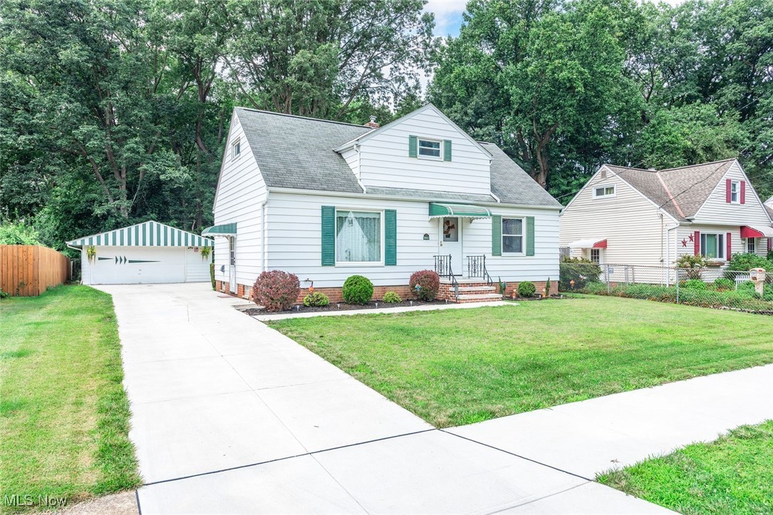 Welcome to a lovely bungalow in Parma Hts. The home has been beautifully maintained by the family for over 60 years. Located in a quiet, well maintained neighborhood just behind Kurtz Park. The backyard is partially fenced. The 2.5 bay, detached garage is in great condition. A new concrete drive and re-bricked front porch was completed in 2024. The exterior of the home is vinyl & most of the exterior wood window sills and thresholds have been freshly painted. Additional improvements include replacement windows throughout, 2-year-old hot water tank, & newer electrical panel. New flooring and 5” baseboards were recently installed in the kitchen, back hall & down the basement stairway. The main floor, full bath, was remodeled with the exception of the tub – very charming! A basement full bath has been updated also. The full basement boasts glass block windows & a finished family room with built-in shelving. The eat in kitchen is quaint and in nice condition with oak cabinetry. A refrigerator and Jenn-air range remain. The current owners use the larger, front bedroom as the master but there is a ton of potential upstairs for a master as well, with the huge dormer and tandem rooms. A third bedroom is located on the first level across from the master. The front foyer has a newer screen door and the living room features a large picture window. This is such a nice home for new home buyers. The owners are offering a home warranty for peace of mind.