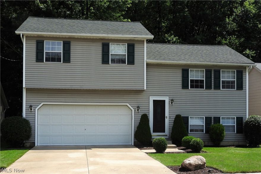 Spacious split is move in ready! Huge Great room creates an awesome open living area * sliders open to a beautiful deck that overlooks a fantastic fenced private back yard that backs right up to the woods * family room has a nook for an office and a half bath * only about 25 years young * over 1500 square feet * all appliances stay * attached 2 car garage * immediate occupancy!