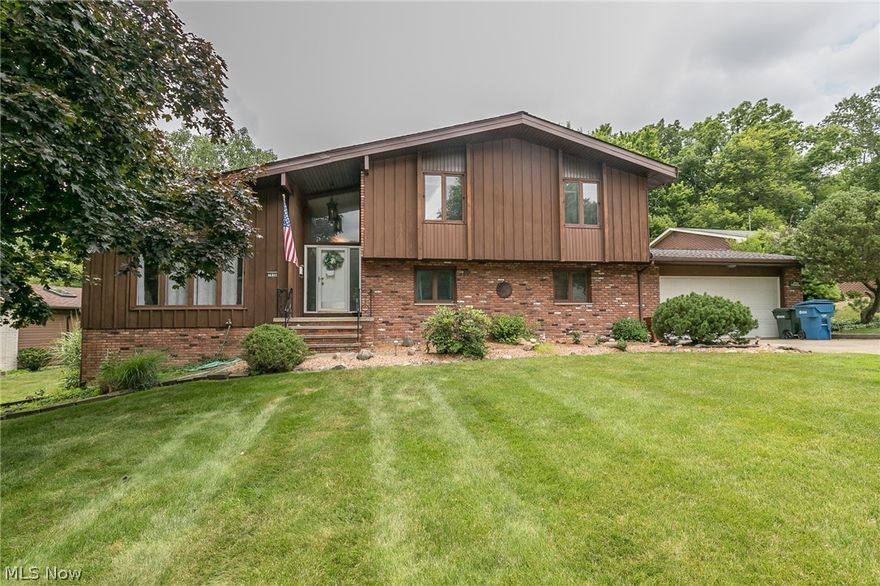 Spacious Split Level In Dogwood Estates! This 4 Level Home Features 4 Bedrooms, 2.5 Baths & enclosed 3 seasons sunroom. With 3,288 square feet of total living space, this home offers room for everyone. Welcoming two story foyer is to the open vaulted living room that awaits you to the left, highlighted by its picture window, which flows into the adjacent dining room. The eat-in kitchen boasts ample cabinetry, all kitchen appliances, pantry, planning desk and side door entry! Head up to the Second level where you'll find the master suite with double closets and en-suite bath. Three additional bedrooms and full bath rounds out this floor. Continue your living space in the lower level family room, where you can find the 3 seasons sunroom with windows galore, ceiling fan and easy access out to the brick patio. The family room supplies a wet bar, wood beamed ceiling and a cozy brick fireplace. Lower level also provides a huge laundry room with utility sink, storage, 1/2 bath & office space.