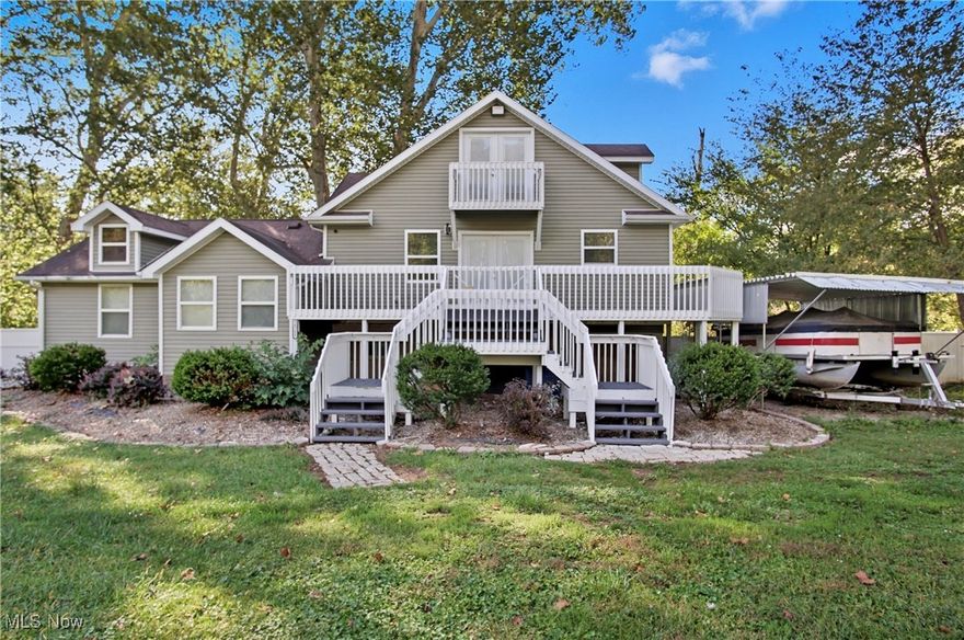 RIVERFRONT RETREAT! Welcome to your own piece of paradise along the scenic Muskingum River! This beautiful home sits on 0.802 acres with a large front yard and an incredible wrap-around deck that leads down to the fishing dock and private boat dock — both included with the sale. Inside, you’ll love the open-concept layout filled with natural light from the large windows and the stunning vaulted ceiling in the living room showcasing a floor-to-ceiling stone wood-burning fireplace. The home features 3 bedrooms plus a versatile loft that could serve as an additional bedroom, office, or guest space. Fresh interior paint throughout! All kitchen appliances and the washer/dryer stay, making it move-in ready. Relax in the 5-6 person hot tub (last used November 2024) or take the boat out for a sunset cruise — the boat stays, too! Updates include a new hot water tank and water softener (2025). This property is being sold As-Is, and all contents will remain. Perfect for full-time living or a weekend getaway — enjoy fishing, boating, and peaceful river views right from your backyard!