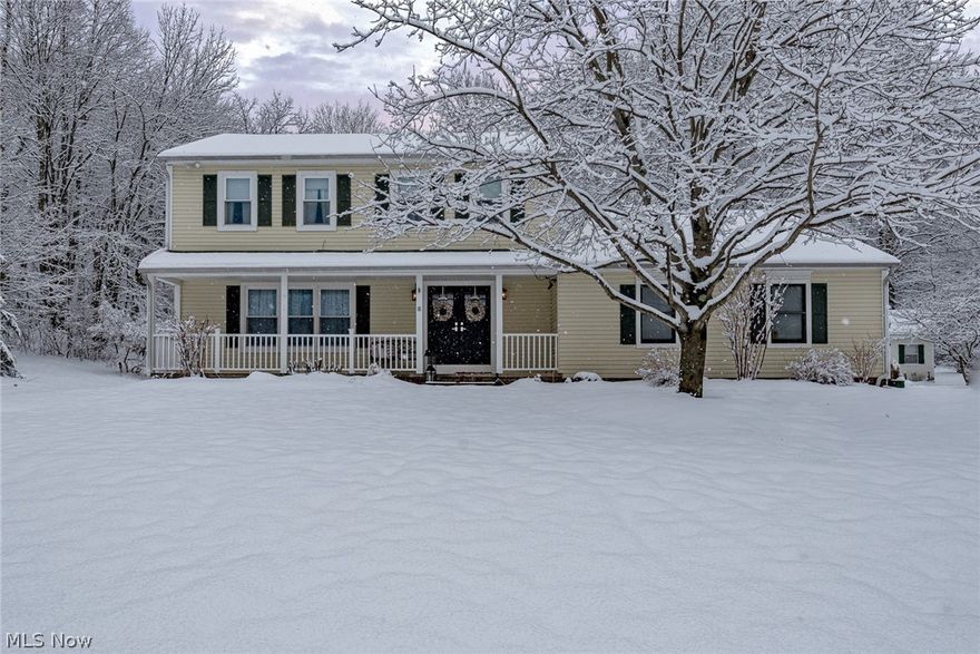 Fall in love with this gorgeous colonial situated on a serenely wooded 1.7 acre lot in Chesterland! With over 2,000 square feet of living space, a delightful back patio, and beautiful updates throughout, this striking home is just waiting for a new owner. Illuminated by a picture window, the living room is spacious and inviting, with cut-out windows that frame the formal dining area. The kitchen features granite counters, stainless steel appliances, exposed brick, and a sunny eat-in area with patio access. Off of the kitchen, you will find a spacious family room with a cozy brick fireplace and a full bathroom. The laundry room and a half bath complete the first floor. Upstairs, there are four spacious bedrooms and two full bathrooms, including the master suite. The lower level was recently renovated with award winning design (CotY Best Interior Renovation) and includes a built-in entertainment center, a wet bar, and a half bathroom, plus plenty of space for storage. Outside, you are su