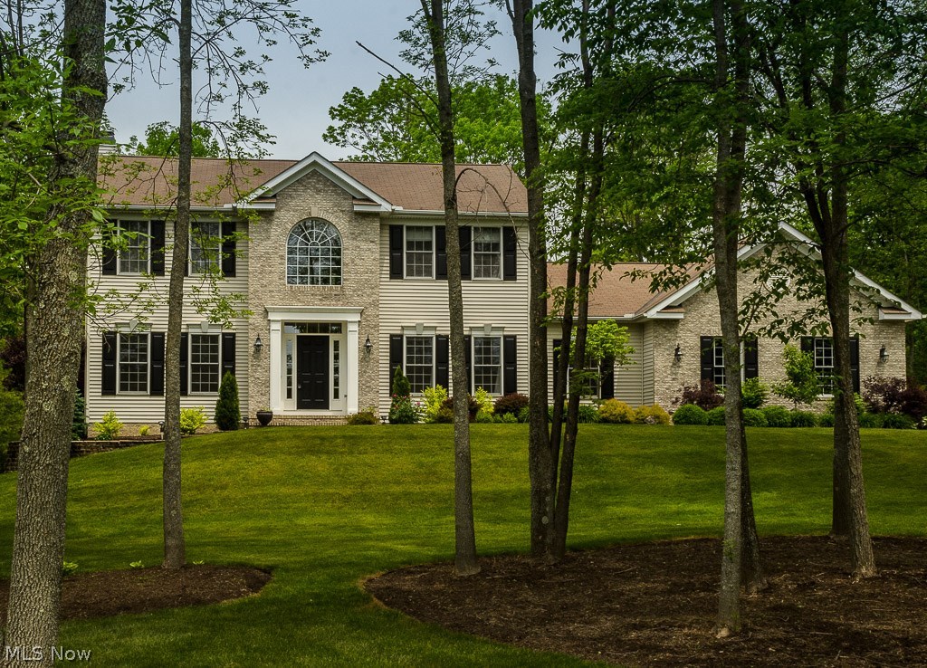 You will feel right at home when you enter this beautifully kept colonial! There is nothing to do but move in your furniture & family! Large kitchen with hardwood floors, newer stainless steel appliances, and center island open to generous great room with large brick gas fireplace which has a beautifully adorned mantel and surround! Sitting room or office is off the two story foyer with wainscoting and open stairway. The formal dining room with crown molding and large windows is light and airy. First floor also offers a den, which could be a fourth bedroom, full bath and laundry room completes the first floor. Walk up the wide staircase to three very spacious bedrooms, with the master bath completely updated with double sinks, granite, glass backsplash and oversized tub, shower plus his & her closets. Full finished basement for family fun with Surround Sound & day light windows, making it light all day! Exercise room with storage closet and French doors! The unfinished area has work be