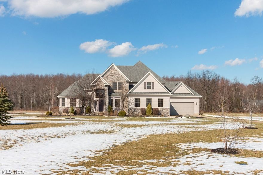 This gorgeous colonial sits on 2.68 acres. It's just over 3,000 square feet and has 5 bedrooms with 2 full and 1 half baths. Walking into the home you enter the foyer with a large window above the main door that provides great natural lighting and a front closet perfect for storage. To the right of the foyer you will enter the formal dinning room area with a chandelier and amazing oak woodwork. The dinning room hallway leads you into informal dinning area and kitchen. The kitchen offers rich cherry cabinetry, beautiful granite countertops and a center island plus all the appliances stay! The informal dinning room is spacious and leads to the glass sliding doors with an absolutely stunning view of the deck and huge backyard. The family room will be the next room you enter which has wood floors and a beautiful gas fireplace.  The master suite is on the first floor and offers a spacious walk in closet, two separate vanity spaces, a large walk in shower and separate spa tub. Upstairs there