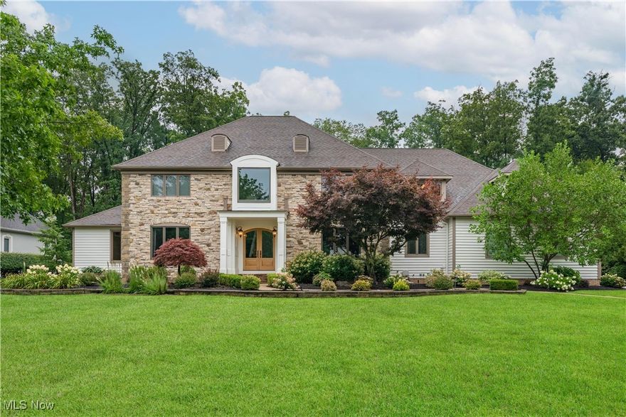 Welcome to this exceptional colonial residence located in the exclusive, gated community of Barrington Estates. Perfectly positioned between the 3rd and 4th fairways of Barrington Golf Course, this home offers stunning views and resort-style outdoor living on a private 0.85-acre lot. A welcoming front entry with double glass doors opens to a dramatic two-story foyer, setting the tone for the spacious, light-filled interior. The Great Room features cathedral ceilings, floor-to-ceiling windows, a stone fireplace and built-in shelving. The gourmet kitchen is ideal for entertaining, offering stainless steel appliances, granite countertops, custom cabinetry, a wet bar with beverage fridge, and access to a large deck with screened-in gazebo. An expansive first-floor primary includes a spa-like bath, a walk in closet and a spiral staircase leading to a glamorous wardrobe suite. A dedicated home office with custom built-ins and a formal dining room complete the main level. Upstairs, you’ll find three spacious bedrooms, each with its own full bathroom, along with a bonus loft space and an additional office or lounge area. Two staircases offer convenient flow throughout the home. The finished lower level expands your living space with multiple recreation areas, custom built-ins, a home gym, and plenty of storage space. This home is a must see!