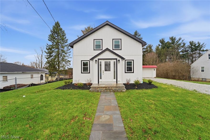 Beautifully renovated 4-bedroom, 2.5-bath home in the highly sought-after Berkshire School District, showcasing exceptional craftsmanship and attention to detail throughout. Step inside to find rich hardwood flooring and a welcoming foyer that opens seamlessly into the dining room and stunning kitchen, complete with granite countertops, custom cabinetry, and stainless steel appliances. The adjoining living room area features sliding doors that lead to the patio—perfect for indoor-outdoor living. The spacious primary suite offers a walk-in closet and a private en-suite bath with custom tile work. A convenient first-floor laundry closet and half bath complete the main level. A striking wood and wrought iron staircase leads upstairs to two generously sized bedrooms, a versatile den or office, and an oversized full bathroom. The lower level has been thoughtfully updated with drainage and a trench system for added peace of mind. Outside, enjoy a private backyard retreat with a fire pit, accessible from the side entry off the kitchen, which also leads to the one-car garage. This home was taken down to the studs and completely rebuilt with quality in mind—featuring all new insulation, drywall, paint, windows, furnace, A/C, structural floor support, flooring, fixtures, vanities, lighting, outlets, switches, and more. Exterior upgrades include new siding, roof, gutters, garage roof and siding, stone driveway, and professional landscaping. Ideally located near schools, shopping, dining, and the charm of Burton Village , this is truly a move-in ready home you won’t want to miss.