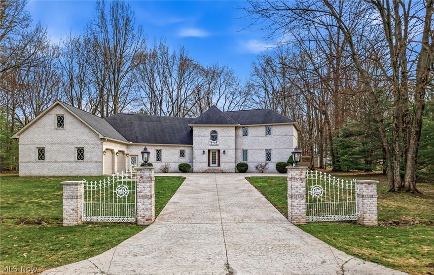 This stunning one-owner European-style home, built by John Brothers and Robert Yuhanick, is located in a highly desirable area and offers exceptional space, craftsmanship, and comfort. A dramatic two-story foyer with a graceful curved staircase welcomes you inside, where cathedral ceilings, pristine hard wood flooring and an open floor plan create a bright and impressive living space. The expansive kitchen is ideal for everyday living and entertaining, featuring abundant cabinetry, extensive counter space, a large walk-in pantry, and a striking 9-foot island. Elegant custom crown molding adds sophistication throughout the home. With four bedrooms, the home includes both a main-floor and second-floor primary suite, each offering a full bath and generous closets. One additional bedroom is beautifully enhanced by two skylights that fill the space with natural light, while the fourth bedroom is also spacious and filled with abundant light. Relax in the sun-filled, window-lined sunroom that opens to a lovely deck for seasonal enjoyment, or gather in the inviting living area highlighted by a fireplace. Additional conveniences include first-floor laundry, three full baths, and an attached 2+ car garage with massive finished storage space above, making this exceptional home both elegant and highly functional.