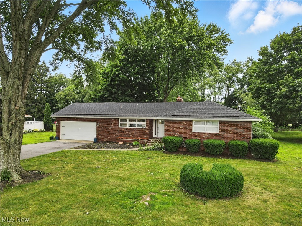 Fantastic location. Brick ranch with full basement. Fenced in back yard. Many improvements to this wonderful home. Newer exterior doors, man doors, garage door, sliding glass door. Roof is one year old with gutters and leaf guard! Newer electric mast with electric box. Newer whole house generator. Newer glass block windows in the garage and basement. R rate installation in the attic of the entire house and garage. All appliances stay. Move right in this updated home!! All the hard work has been already done.