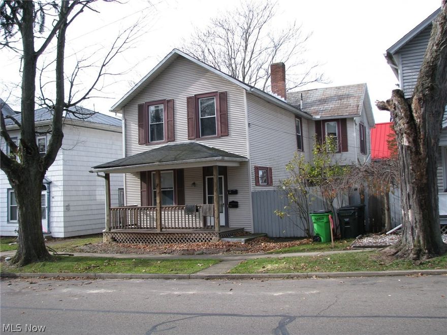 Duplex with one bedroom, bath and newer large kitchen on first floor and two bedrooms and a bath on the upper floor.  Income producer.