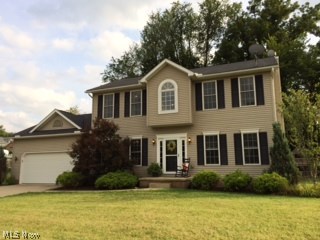 Quiet and peaceful neighborhood at the edge of town w/ city utilities. A pottery barn feel as soon as you walk in. This is a 3 bedroom, 2.5 bath, 2 story home. 2136 sq. ft. sitting on a LARGE corner lot measuring .364 acres. Open the door into a 2 story foyer, open staircase, railed balcony, and look-over. Beautiful laminate floors runs from the front entry throughout the eat-in kitchen. White woodwork throughout the entire home making a bright and exciting interior. The white kitchen is fully equipped w/ stainless steel appliances, dark counter tops, eat-at bar, and tasteful lighting. 1st floor laundry and .5 bath, a formal dining room or office, fireplace w/ 2 gas logs in the living room, and private french doors can close off the den area. An over sized 2 car garage. The awesome back deck 13x20 is constructed of the new "composite " maintenance free material. Upstairs you will find the coolest of children's bedrooms and a large master suite w/ vaulted ceilings, walk-in closet. The m