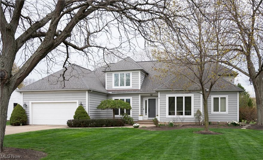 Stunning 4 bedroom 2.5 bath modern home offers true one-floor living! Open concept abounds with a comfortable flow, perfect for entertaining! Gorgeous two-story great room with floor-to-ceiling brick wall and fireplace! Transom windows above two sliding glass doors flank the gas fireplace and lead to the outdoor deck, letting in loads of natural light! Dining room offers charm and character with pillars and is currently being used as a lounge! Bright and airy newly updated eat-in kitchen with large center island and stainless-steel appliances! White Shaker cabinets, gorgeous black granite and gold accessories make for a classically modern look! Sliding glass doors in the kitchen dining area bring the daylight in and modern light fixtures keep it light at night! Beautiful French doors will keep things quiet in your home office! First-floor private owner’s suite includes an oversized bedroom, a walk-in closet, and a glamorous bathroom, sure to please! The spacious laundry room with extra