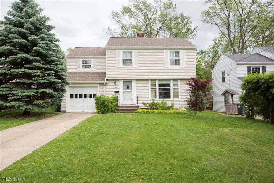 Cove ceilings, arched doorways, built-in shelving, abundant natural light, and gorgeous hardwood floors can be found throughout this inviting, charm filled colonial! The main floor offers a spacious living room with a large picture window, fireplace, and hardwood under the carpet, plus a formal dining room also with hardwood under the carpet, kitchen, half bath, and access to the covered back porch and attached garage. On the second floor you’ll find a full bathroom and 3 spacious bedrooms, each with beautiful hardwood floors and plenty of closet storage; one bedroom even offers a balcony overlooking the back yard! The lower level offers a laundry/utility room, storage space, and rec area for your future man-cave, media room, or whatever else you may need. This home also has a great back yard! It is fully fenced-in with mature trees and plenty of space for outdoor entertainment, children, and pets. Additional highlights include newer roof (2012) and a great location near parks, pools,