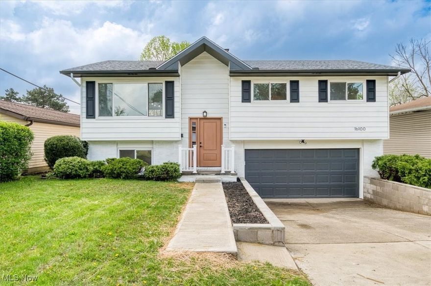 Welcome inside to this tastefully redesigned bi-level home! Situated within one of Maple Heights most sought after communities is 16100 Shirley Avenue. Pull up to a refreshed exterior with fresh paint, new lighting, a new garage door with opener and newly built retaining walls. Step inside onto new LVP flooring spanning throughout the house. A few steps up invites you into an open living space, where new light fixtures complement an abundance of natural light. The kitchen has been upgraded to include soft close, two tone cabinets, with 42” uppers, beautiful tile backsplash, stainless steel appliances, a large island with pull up seating, and unobstructed sight lines to the street and backyard. Down the hall is a large updated bathroom with new tile, vanity and fixtures. Three spacious bedrooms complete the first level. Down the stairs is an incredible living space that can easily accommodate leisure, recreation, work or workout. The half bath has been upgraded with a new vanity and fixtures. A large storage space and laundry/utility room complete the lower level. 

There’s a two car attached garage, for added convenience. The backyard is fenced with a new concrete patio, perfect for cookouts or a private night to watch the stars.

A new roof, New HVAC, matte black fixtures throughout, new neutral paint and a home warranty are all included for peace of mind. POS compliant. Welcome Home…