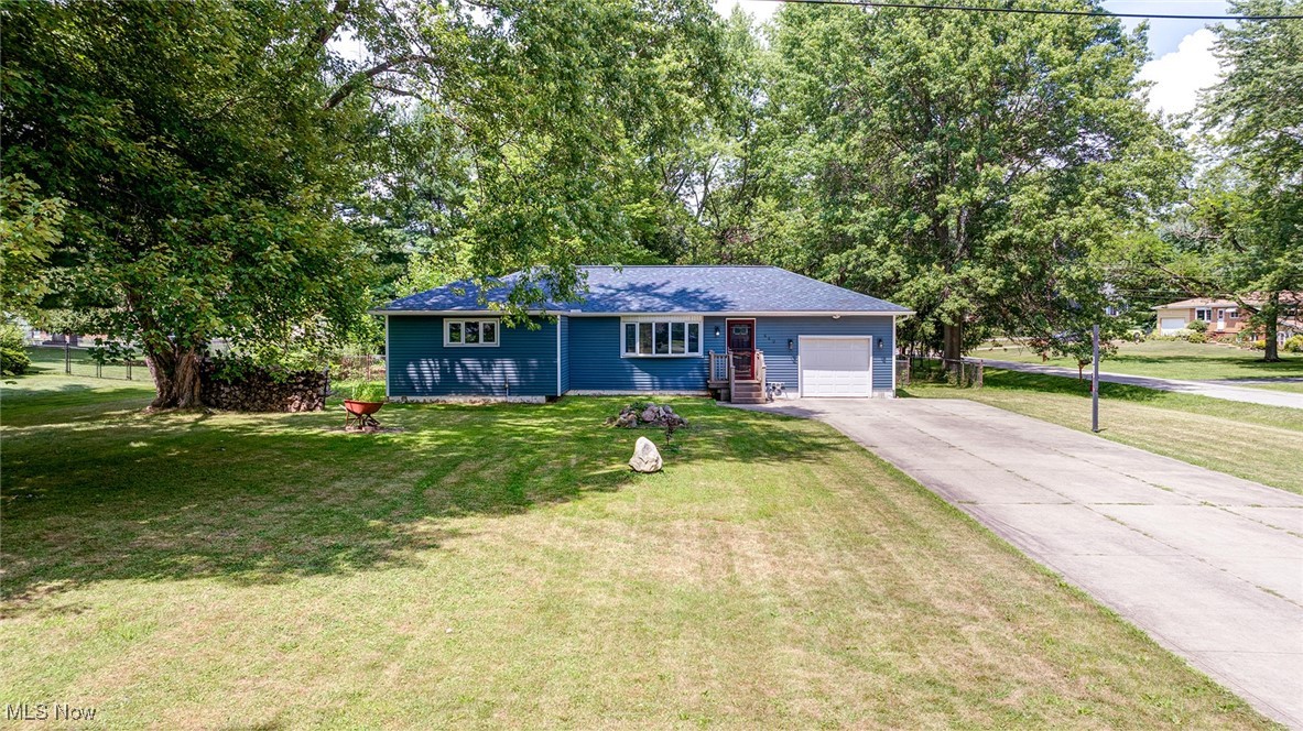 STOP! This one has had all the big dollar updates done! Roof shingles: 2022. Vinyl siding, trim and gutters all new in 2023! High end furnace and air conditioning, new in 2021, including vents, ducts and electrical and electronic thermostat! Tankless water heater new in 2021! The stove, dishwasher, main bathroom sink and toilet- all replaced in 2025! All new interior paint- 2025! Garage door motor and liftline replaced in 2025! This 3 bedroom ranch is located on a quiet street and on a half acre lot. Big open kitchen with solid surface counters and ceramic tile flooring. Vinyl replacement windows and updated sliding door. Don't miss out on this one!
Wooden stairs from slider to patio will be installed.