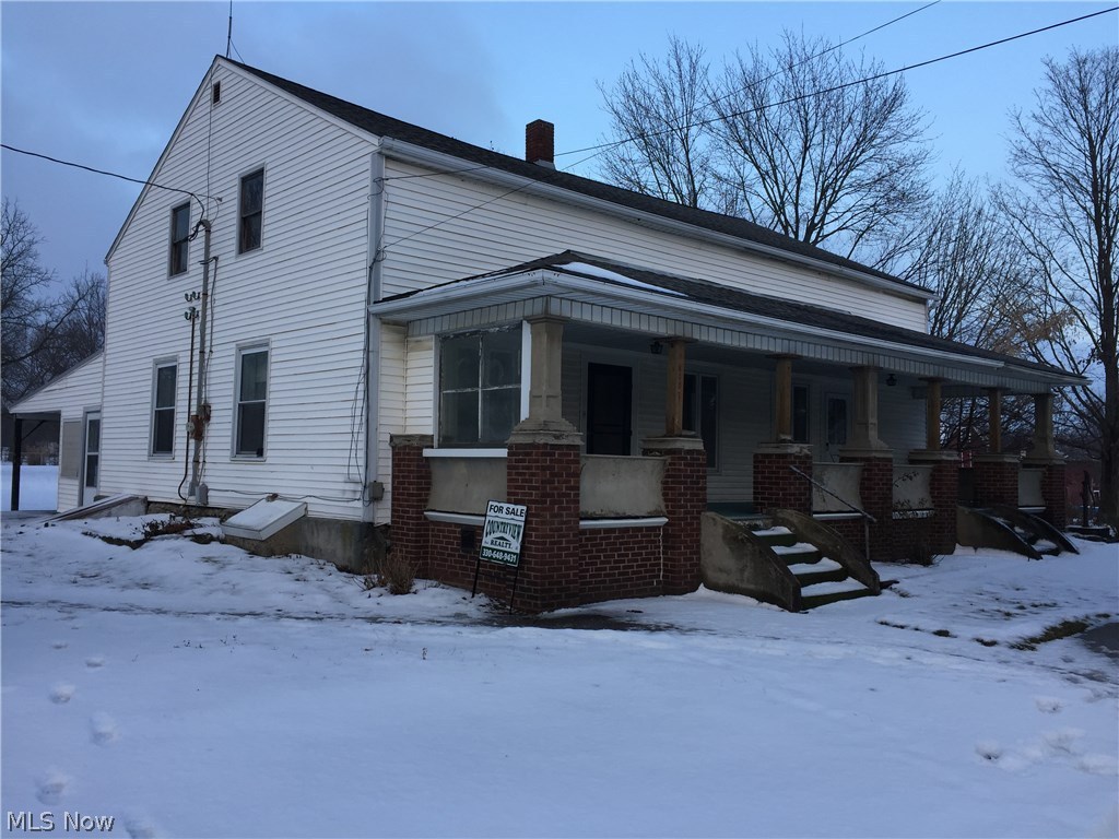 Commercial property with a single family century home near corner of SR 83 and SR 162. Second parcel included 004-09B-31-017. The lot size is for both parcels per the auditors records, please verify. The Historical Society will be taking the old gas station building.