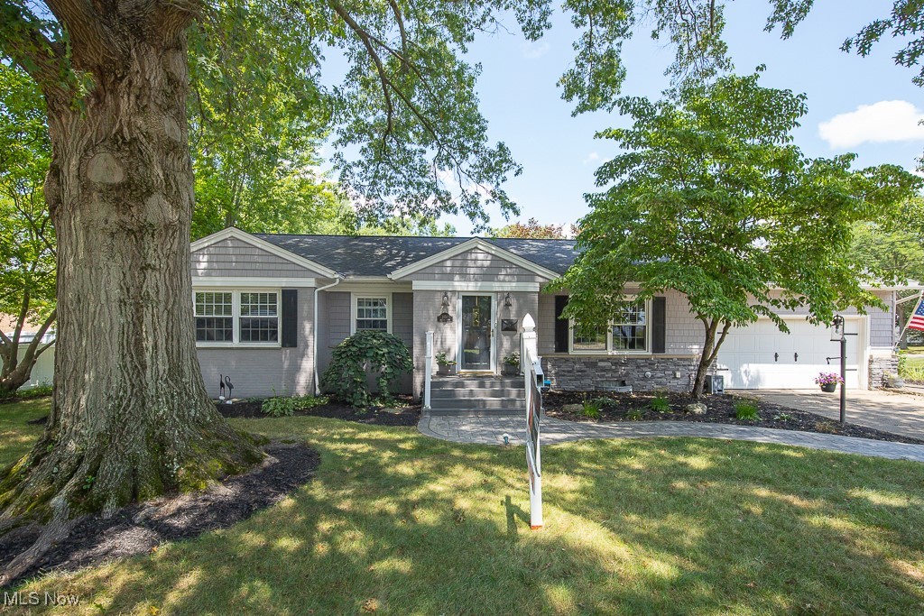 Welcome to your dream home in desirable Northwest Akron, 2 blocks from Stan Hywet! This beautifully renovated three-bedroom ranch exudes modern charm and comfort, making it the perfect retreat for families and entertainers alike. As you step inside, you're greeted by an inviting open concept living space that seamlessly combines style and functionality. The heart of this home is undoubtedly the exquisite kitchen, a chef's dream come true. Featuring a stunning island that serves as a focal point, it boasts elegant granite countertops, stainless steel appliances, and floating shelves that add a touch of sophistication.
Adjacent to the kitchen, the spacious living area provides an ideal setting for gatherings, with abundant natural light pouring in through large windows. From here, you can access the additional sunroom, a serene space that overlooks the gorgeous backyard. Imagine sipping your morning coffee in this tranquil oasis, surrounded by lush greenery and the beauty of nature.
The outdoor space is equally impressive, featuring a stamped concrete patio perfect for alfresco dining and entertaining. The oversized shed offers ample storage for gardening tools or outdoor equipment, ensuring your backyard remains a sanctuary of peace and beauty.
Venturing to the lower level, you'll discover a partially finished area that offers endless possibilities. A full bathroom makes it convenient for guests, while the spacious family room is perfect for movie nights or cozy gatherings. Additionally, a workshop area provides the ideal space for hobbies or DIY projects.
For your peace of mind, a one-year home warranty is included, making this stunning ranch not just a house, but a home ready to create lasting memories. Don’t miss the opportunity to own this exceptional property that beautifully blends modern living with comfortable charm. Welcome home!