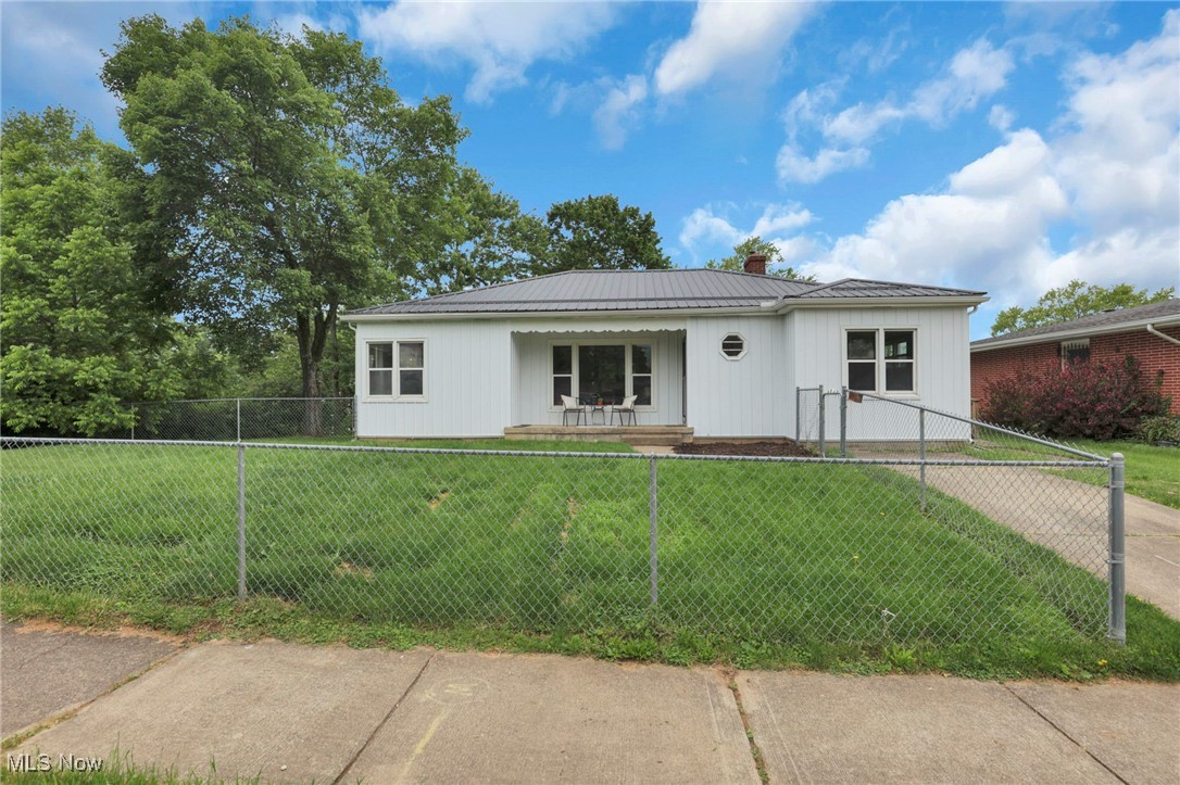RECENT UPDATES!! Ranch home with space to grow! Main level offers living room, dining area and kitchen. Two bedrooms on main floor and additional space fora third main level large bedroom, rec room or playroom, with a full bath. Basement has 2-3 extra bedroom and one additional full bath. Fenced front yard, off street and on street parking as well as a two car detached garage behind home with alley access. Newer metal roof. updates in the last 4 months include: drywall and flooring in basement, siding, paint throughout, butcher block counters and carpet. Within walking distance to elementary school, close to downtown Newark and Heath.