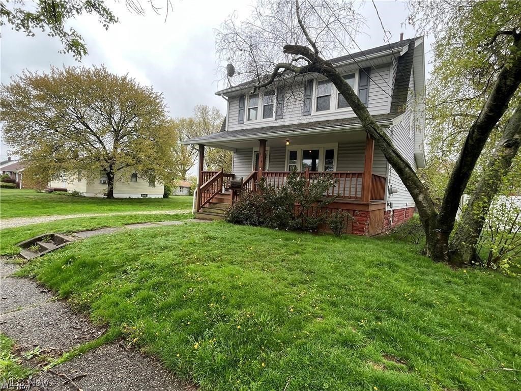 This 3-4 bedroom home sits on a double lot and offers great potential for either a homeowner or investor. Inside, a traditional Colonial layout unfolds, featuring a welcoming living room with a classic fireplace. Flowing seamlessly into the dining room, the space feels open and inviting. The fourth bedroom, per tax records, is conveniently located downstairs, offering versatility as a home office, playroom, or guest room. Upstairs, three bedrooms and an updated bathroom ensure ample comfort. Updates include kitchen flooring, windows, and new appliances. Just 9 minutes from Akron University, this home, previously rented at $1250, offers income potential. The semi-private yard is perfect for outdoor activities or relaxation. Despite the removed downstairs carpet (opportunity for personalization), this home is ready to welcome you.