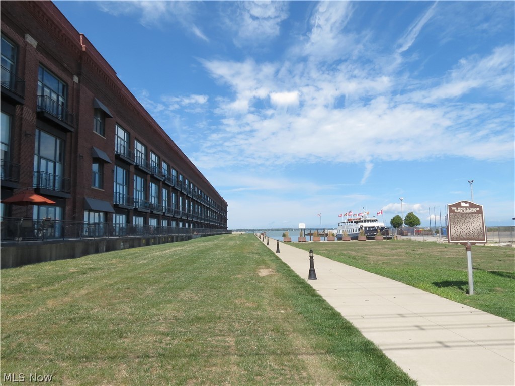 Stunning views of Cedar Point and downtown Sandusky from this second floor condo at the Chesapeake Lofts. Open living room and kitchen areas that lead out to the outdoor patio. Cherry kitchen cabinets with granite counter tops. Custom window blinds. Master bedroom with attached master bath. Solid surface counter tops in both bathrooms. Buy in to the lifestyle. Great walk-ability to downtown amenities including exquisite restaurants, a taphouse, micro-brewery, theater and summer events. This is a very rapidly growing area! Association offers elevators to each floor, work-out room, pool and laundry. Secured building and gated community. Garages available separately for sale or rent. Dockage available at city marina next door.