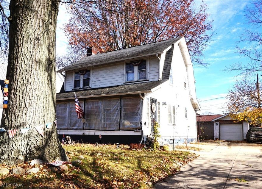 Large older home with a family room and half bath on main floor. Spacious living room with a fireplace. Formal dining room. Enclosed front porch. Three bedrooms and a full bath upstairs. One car garage and concrete driveway.