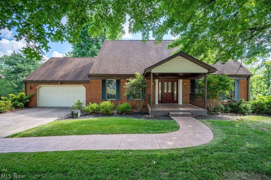 Welcome to this roomy home in North Hills!  This 4 bed 3.5 bath home has much to offer!  You'll appreciate the curb appeal of the well maintained lot and timeless style, and the beautiful stamped concrete walkway and welcoming new front porch.  Inside, the formal living room connects to a formal dining space.  The home has been extended to allow for an open concept kitchen and family room space with plenty of room for entertaining as well as everyday enjoyment.  The large kitchen features KitchenMaid cabinetry and offers expansive granite counter space for prepping and serving. The family room includes a fireplace with newly installed stainless insert and cap, ensuring safe modern functionality for cozy mornings or evenings.  The attached sunroom includes a bed swing, with beautiful views of the wooded property behind.  The first floor also features one bedroom and an updated full bath, for main level living.  Upstairs, three more large bedrooms, two full baths, and plenty of storage make this home very functional.  The basement has a large finished rec room, which opens onto the covered patio.  A two car attached garage rounds out the great features of this home.  With nearly 4,000 square feet of finished living space, this home has so much potential and is just waiting for it's new owner(s) to call it home!