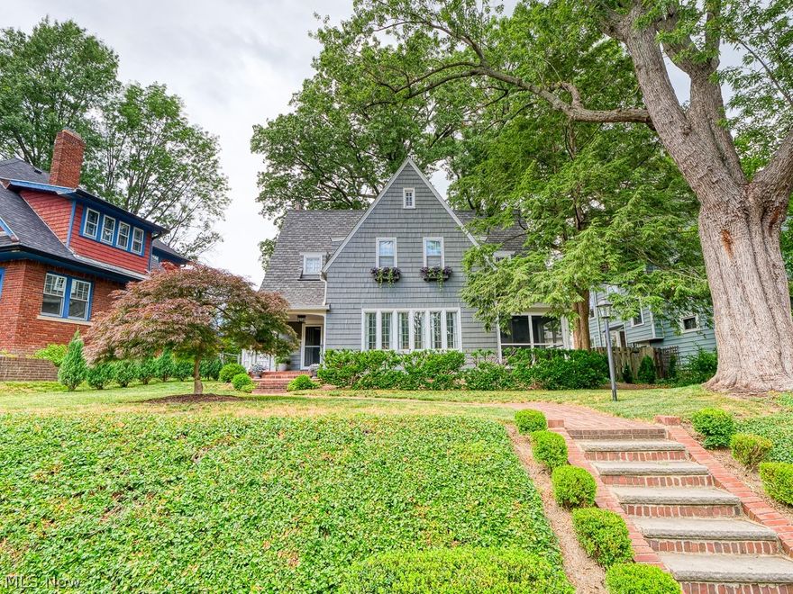 If you're looking for a one-of-a-kind home in a perfect location, you've found it. This classic colonial is full of old world charm and character. Perched above street level, a mature, manicured landscaping greets you with grandeur. Nestled in a highly sought-after neighborhood: just a mile from Lakewood park and a stone's throw to downtown Lakewood; within a 15 min. drive of downtown Cleveland, airport, local marina and Metroparks. The location is only the beginning. Inside, you’ll notice much of the original character has been well-preserved including gorgeous stained and leaded glass, woodwork, french doors, plaster motifs, hardwood floors, breakfast nook and butler’s pantry. Both fireplaces, including one in the master, have been converted to gas. Small fifth bedroom could be easily converted into a master bath. Sit out and enjoy a morning coffee in the screened-in porch, or cozy library. With such rich character and history, this home is truly unique. Recent updates include a new