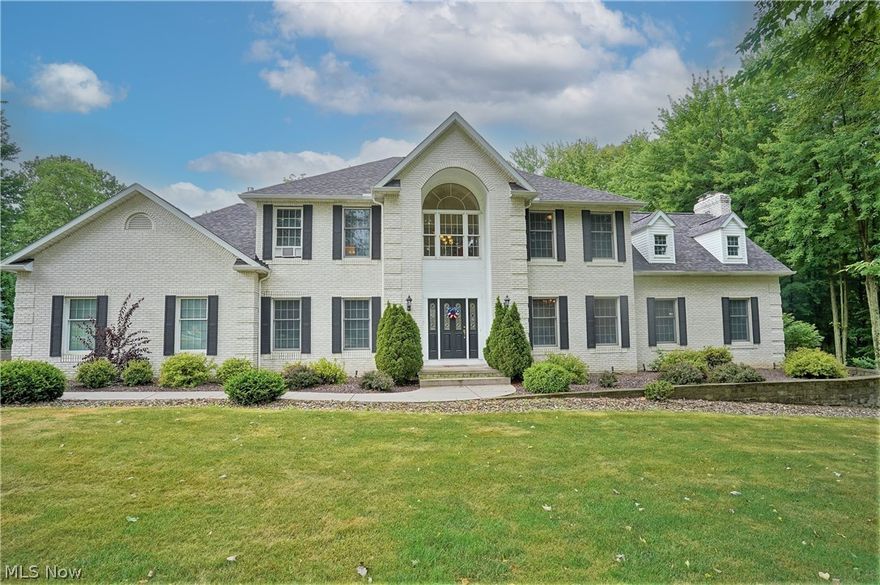 Situated on a magnificent 2 plus acre lot in the Highland School District this custom-built brick and vinyl colonial boasts a spacious open floor plan. Featuring a two-story foyer, sizable kitchen with cherry cabinets, 2 story great room with a wood burning fireplace and wet bar, sunroom with skylights and a slider that leads to the deck, dual staircases, cherry moldings throughout, and a master bedroom with ensuite bath. The walk-out lower level includes a 4th bedroom, wet bar with full size refrigerator, full bath, rec room, and tons of storage. So much to enjoy outdoors with a fantastic two-tier deck, hot tub, patio area, superb landscaping, and lots of privacy.  Need room for “toys”?  Not only do you have a 3-car attached garage, but there are also 2 12 x 16 storage sheds plus an additional 32 x 24 garage.  Both inside and out 7822 S Passage Dr has been immaculately cared for by this owner. If you want space and a breathtaking lot, look no further.  Call for your private showing to