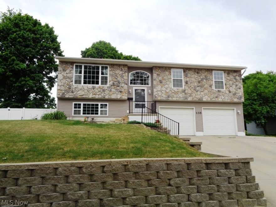 This well maintained home offers a private fenced in backyard with custom patio perfect for entertaining or just spending time with family. The Stone/vinyl exterior invites you into this beautiful home with neutral decor. The spacious living room overlooks dining room with deck access. Custom fully applianced kitchen with plenty of counter space/cabinets/pantry and island. Master bedroom with walkin closet and full bath. Second and Third Bedrooms with main full bathroom. First Floor Laundry. Family room great for relaxing with half bath/mud room area. Two car garage with plenty of space for storage. Updates include: Radon Mitigation system, All Interior paint, custom blinds, landscaping, vinyl fence $10,000 and custom patio $5,000.