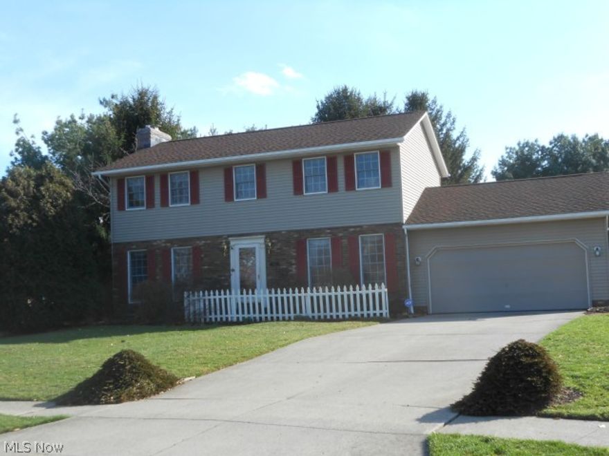 Spacious brick and vinyl Colonial.   Warm Great room with a fireplace, Formal Dinning for your holiday guest.  Kitchen has a bay window overlooking the back yard. The appliances complete the kitchen.  Attached is a dinette area with French doors to a double deck. Then slip through the back yard to the park.  With the sun setting, you make your way to the top of the stairs to the master with bedroom and bath; there is a sitting room adjacent to the bedroom for evening reading, or a great space for a nursery. Two additional bedrooms and a full bath.  The lower level has a finished recreation room. The additional room for a sewing, craft, office or play room. Two car garage.