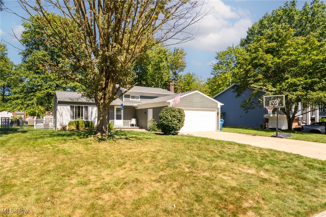 Beautifully maintained split level in a top-rated school district. This home features hardwood floors on the main level, spacious bedrooms, a cozy fireplace, and an eat-in kitchen. Three bedrooms on the upper level, and a versatile fourth bedroom tucked away on the lower level split, perfect for a home office or guest bedroom! While outside a large deck and fully fenced backyard create the perfect setting for entertaining, relaxing, or pets. Additionally the partially finished, waterproofed basement offers extra living space. With a newer roof (2022) and prime location, this home is move-in ready!