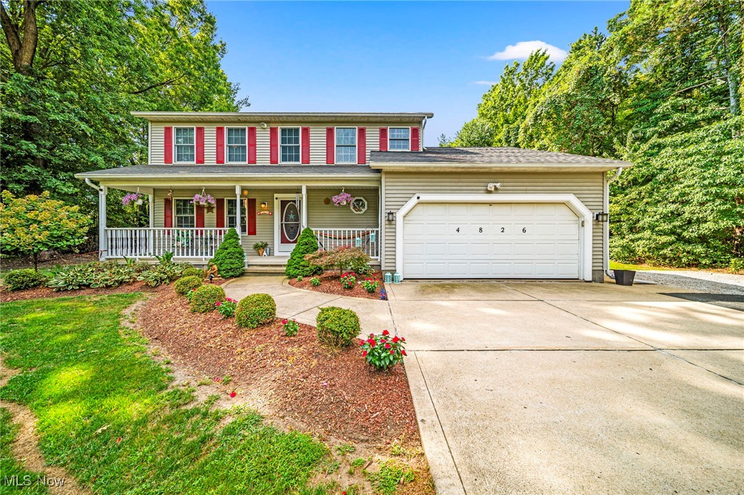 Gorgeous. Private. This 4-bedroom, 2.5-bathroom colonial offers the perfect blend of comfort and space, tucked away on nearly an acre in the desirable Perry School District. The front porch is framed by a parklike setting and beautifully maintained landscaping, creating a warm welcome and a perfect spot to enjoy the outdoors. Inside, the first floor includes a formal living room, a formal dining room for memorable gatherings, and an eat-in kitchen with sliding doors that open to the deck and above-ground pool. The family room features a cozy gas fireplace, ideal for relaxing evenings. A convenient half bath completes the main level. Upstairs, the primary suite offers a private ensuite bath, while three additional bedrooms and another full bathroom provide plenty of space. The partially finished basement extends the home's functionality with room for recreation, hobbies, or storage. Outdoors, the backyard is a retreat designed for entertaining and everyday enjoyment. Expansive green space offers room for gardening, outdoor fun, or quiet relaxation. Imagine summer afternoons by the pool, autumn gatherings on the deck, or peaceful mornings surrounded by nature. An attached two-car garage adds everyday convenience. This home balances privacy and comfort with proximity to schools, shopping, local amenities, and Lake Erie, an ideal combination of lifestyle and location. *Sale is contingent upon seller finding suitable housing.
