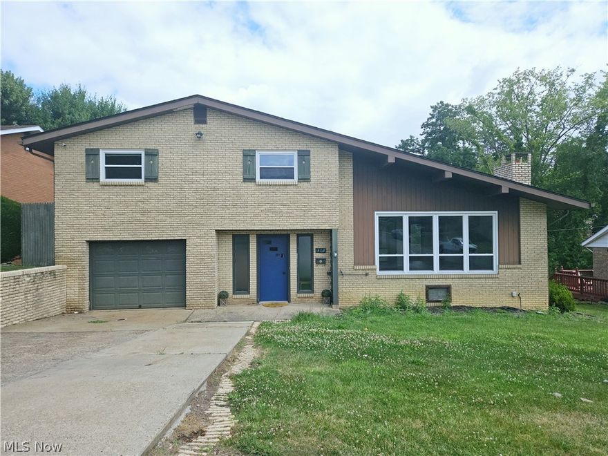Welcome to your dream home, a unique multi-level marvel in a great part of Steubenville! Recent updates include a new 40-year roof with a transferable warranty (installed 6-8 months ago), a new HVAC system (6-8 months old), and a tankless hot water heater (only 2 years old). Additionally, new windows were installed in 2017. You'll love the open floor plan that seamlessly connects the living spaces, enhancing the home’s flow and functionality. The living room features vaulted ceilings and an expansive picture window, creating a light-filled and airy ambiance. Step out from the dining room onto a spacious deck where you can unwind and entertain. On the upper level you'll find a master suite offering a comfortable sanctuary, along with two nice sized and well-appointed bedrooms, and a full bathroom. The versatile fourth bedroom off the foyer can double as a sitting room or productive home office. In the basement you will find a cozy recreation room with brick accent walls, a gas fireplace, and a half bath making it the perfect retreat. While the home needs a few finishing touches, it does come with a home warranty for your peace of mind. Schedule your private tour today and envision your new life in this Steubenville stunner!