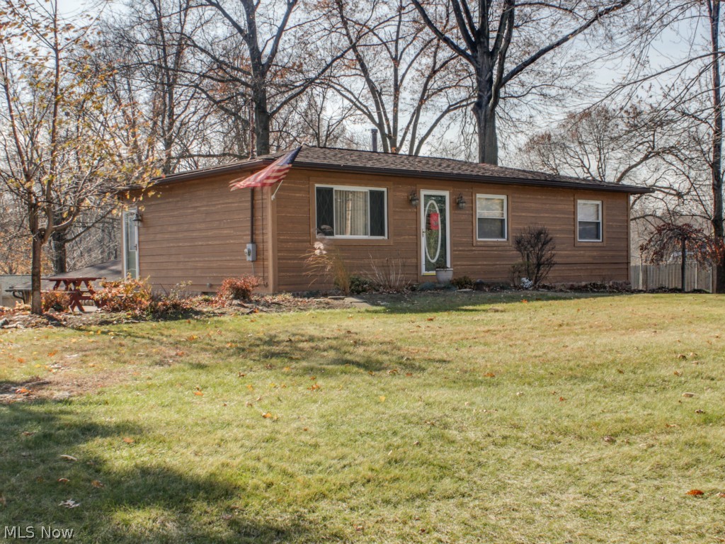 Wonderful ranch, near the Lake! 3 bedroom, 2 full bath. Bright applianced kitchen, hardwood floors, Hardie Board exterior, newer roof. Downstairs you will find a finished walk-out basement with bar area, full bath with jetted tub and sliders to fenced in, stamped concrete patio. Nice private lot.