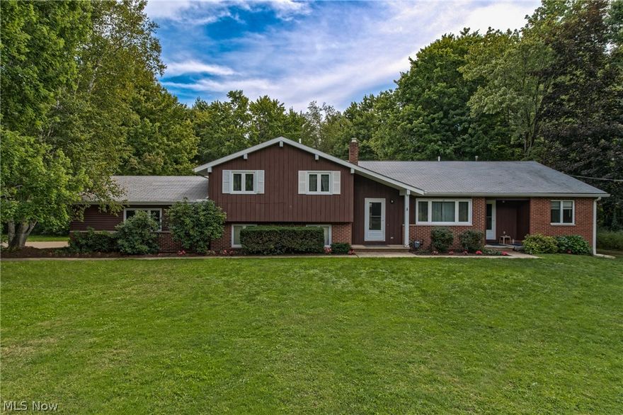 Love the country life? Looking for an economical horse property in Kenston School District with room for horses plus fabulous outdoor living space? You must see this 4 bedroom 3 full bath, versatile home on 5 acres with 3-5 box stall barn and in-ground pool. Sunroom/great room addition features vaulted ceilings and wall of windows, opens to expansive tiered deck and in-ground pool. Kitchen with breakfast bar seating, appliances stay, is adjacent to dining room. First floor master suite addition includes extra large master bath with hot tub. Have a home business? addition also includes 17x14 office with private entrance, could double as in law suite, or additional bedroom. The finished lower level (not basement) includes a rec room/family room, full bath, and additional 13x11 finished room that could be work out room, playroom, workshop, the possibilities are endless. This reasonably priced unique horse property with in-law suite/home office, in ground pool, inviting sunroom/great room addition, barn with newer roof (2013) is a convenient commute to Cleveland, only minutes to 422. Septic passed sept. 2015. Additional adjacent 5 acre parcel could be purchased separately to equal 10 acres.