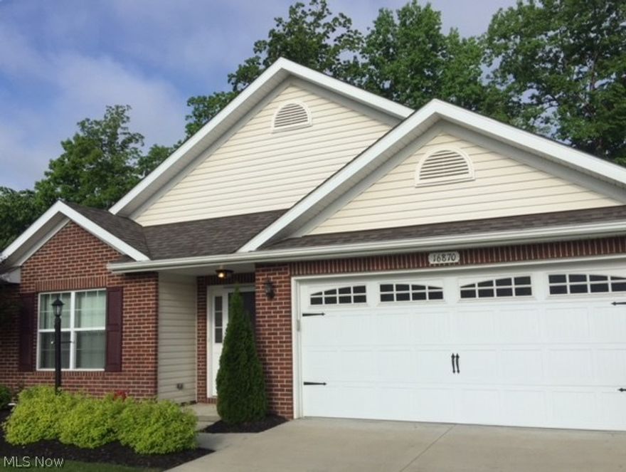 William Thomas Homes Danbridge floor plan Brick front ranch style cluster!  Easy living all on one floor 3 BRs 2 Full Baths, open floor plan, foyer entrance. 2 BRs and full BA on one side of the home; nice size Master BR with walk-in closet and private BA on the other side, great room with vaulted ceiling, dining room with side windows,  beautiful sunroom with sliders to a12x12 private patio and backyard, kitchen with appliances that stay, laundry room with washer/dryer that stay,extra deep attached 2+ car garage. Exterior lighting.  The property is on a cul-de-sac with community road access only. Built in 2013, 1614 sq ft.  The interior has been recently painted. Carpets will be cleaned for the new owner. 
Easy access to restaurants, shopping, I-71, CLE Hopkins Airport, I-480, and I-80 Ohio Turnpike ** 2.4-miles to Middleburg Heights Rec Center, playset, park, and Cuyahoga County public library