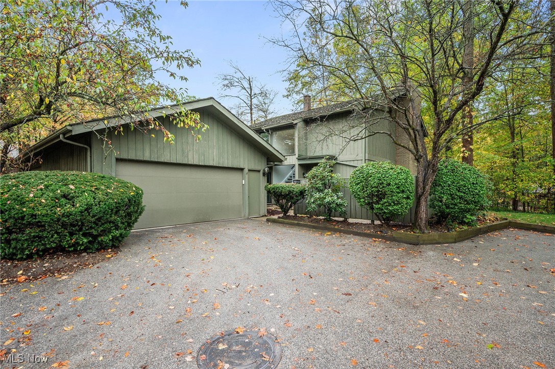 Welcome to 702-22 Fairington Dr, Aurora – a thoughtfully renovated condo offering modern comfort and timeless style! Step inside this stunning, move-in ready home and experience modern comfort at its best. The inviting living room features plush carpeting, a cozy fireplace, and charming brick built-ins, creating a warm and elegant space to relax. Sliding doors lead to a bright enclosed sunroom, perfect for enjoying peaceful views year-round. The open-concept layout flows effortlessly into the dining area, enhanced with stylish built-in shelving and modern lighting. Double doors open to a serene backyard surrounded by mature trees—an ideal setting for outdoor relaxation. The newly renovated kitchen is a true showstopper, showcasing quartz countertops, new stainless steel appliances, ample cabinetry, and a breakfast area—all complemented by a crisp white palette that enhances the home’s bright and airy feel. Smart features, including an updated thermostat and lighting, add a touch of modern convenience. The main floor also includes a half bath and laundry area for everyday ease. Upstairs, you’ll find three spacious bedrooms and a full bath, along with a luxurious primary suite featuring its own private bath and access to a cozy balcony —offering beautiful wooded views and a tranquil retreat. Additionally, new windows, doors, HVAC, and water heater installed in 2025.  Every detail of this home has been thoughtfully updated to combine elegance, function, and comfort. Don’t miss your chance to own this stylish Aurora condo that perfectly balances modern living with a peaceful setting!