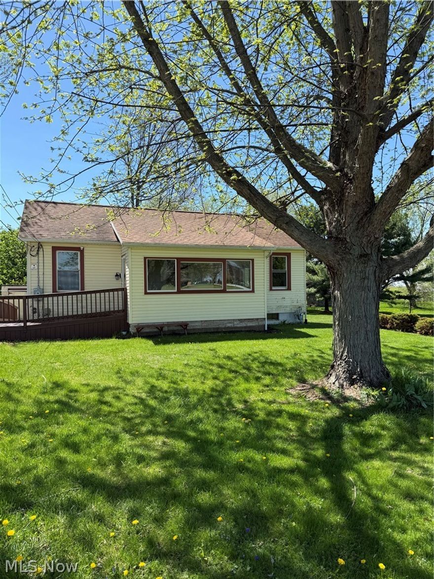 Cozy country living at a great NEW PRICE! Remodeled bungalow located just out side of Wooster on a full acre! Remodeled and updated with a new kitchen, new bathroom, hardwood floors refinished.  Other wonderful features include a detached one car garage with attached workshop or studio space, updated windows, central air, new 50 gallon hot water heater, updated electrical panel, roof is approximately 12 years old, and well pump replaced September 2022.  Full unfinished basement. Beautiful flat lot with storage shed.  Triway School District.