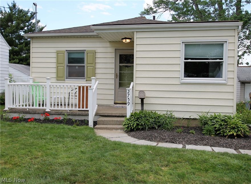 This charming MOVE IN READY 2 Bedroom home with Basement and updates galore is not to be missed ! Updates included Laminate flooring in Living Room, Kitchen, Second Bedroom and Bath.  Master Bedroom has New Carpet.  Other updates include Kitchen Cabinets, Counter Top, Lighting and Freshly Painted throughout.  All Kitchen Appliances remain as well as the Washer and Dryer.  There is additional Living Space to enjoy by yourself or with Family and Friends in the Lower Lever Recreation Room with Bar.  The Lower Level also has access to the Beautiful large Backyard which would be great for cook outs and family functions. Don't forget the peaceful Front Porch to enjoy a cup or coffee or tea or just to view the the lush foliage and manicured landscape.  Schedule your tour today, you won't be disappointed !