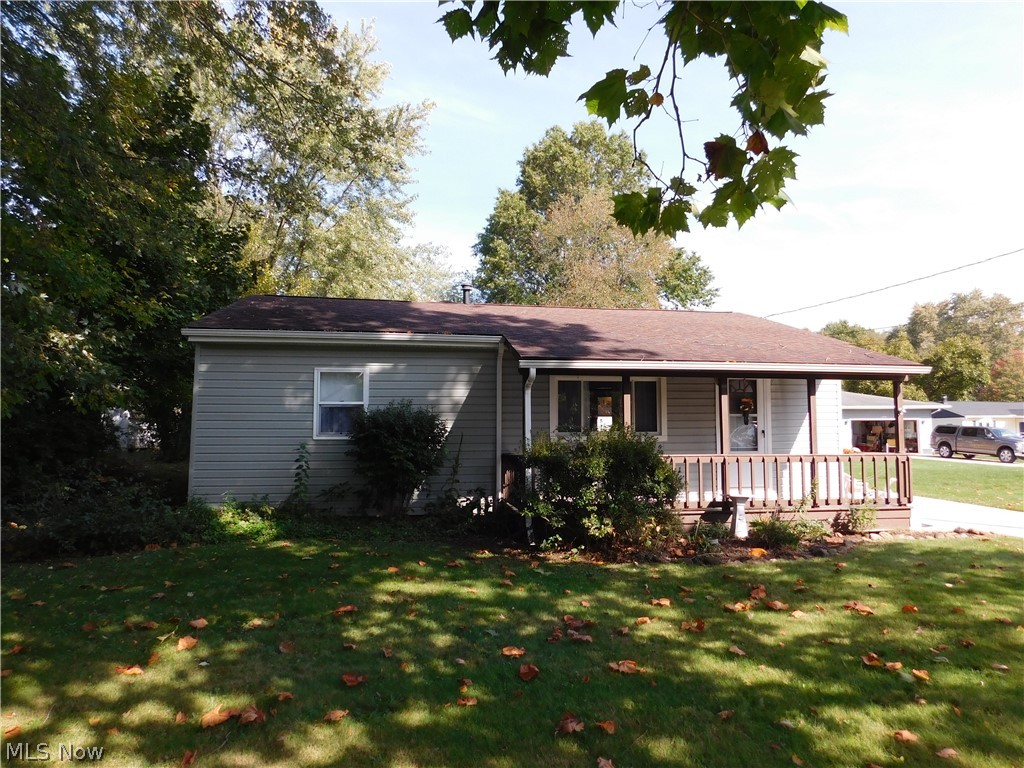 Look no future for your Charming Country Ranch in Brimfield Ohio. This is a cutie with low maintenance!! Everything on one floor. Spacious eat-n kitchen with appliances, plenty of cabinets and counter space. The living room has newly installed LVT wood flooring and a large picture window allowing the morning sun in. The master suite is 14x13 with a walk in closet and full bath. There is a bonus room that would make a great den/home office, reading nook or second TV room. The second bedroom has a built in dresser/cabinet and hardwood floors. But wait, that's not all. Enjoy time spent on the covered front porch. There is a concrete drive leading to a two car garage with an attached workshop. Across the street is Brimfield Lake with an optional HOA if desired. There is a newer water softener. The seller had the well inspected in Feb. 2020. City Sewers. Move in condition. Don't wait on this one.