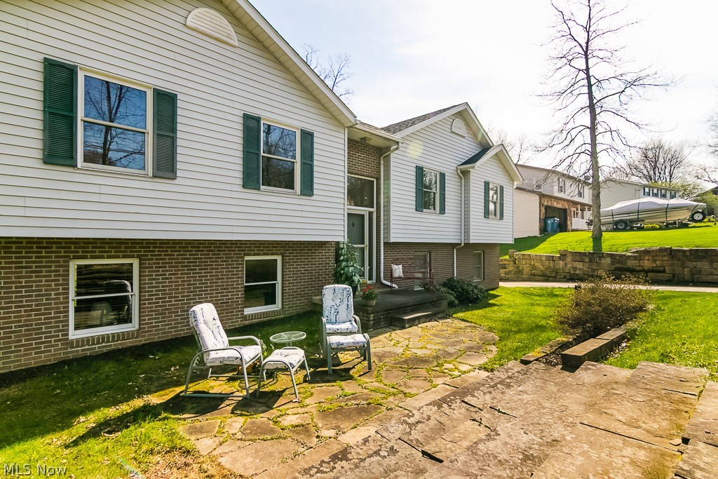 DONT MISS THIS pristine 3 bedroom, 3 bath split level in New Franklin TWP. Over 2000+ sq ft of living space complete with walk out lower level. Sitting on almost an acre of land you will love everything this home has to offer. Need work space? Extra storage? The over 800 sq foot additional detached garage, which includes it's own 50 amp service, gas hook up, and is fully insulated, is a perfect solution! Featuring a large eat in kitchen with view of the backyard and access to a large deck. The lower level is finished and walks out to the backyard patio. Upstairs you will find 3 bedrooms and a large living space. This home has a 2 car attached garage and a 2 gar detached garage with workspace (24x36 w/ electric and gas line ran). Minutes form Nimisila Reservoir, Portage Lakes State Park and close access to Akron/Canton airport. Call today to schedule your private showing and make this home yours! UPDATES INCLUDE: New roof 2015, water heater 2017.