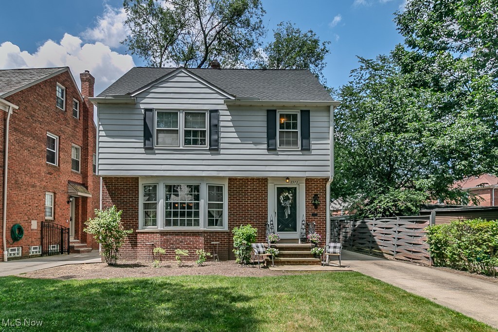 Welcome to this lovely 3 bedroom, 1.5 bath colonial situated on a beautiful tree-lined street near John Carroll University. Brimming with architectural character, the home features gleaming hardwood floors, cove ceilings, a bay window, and decorative moldings throughout.
The inviting living room boasts built-in shelves and large enough for any occassion. A formal dining room is enhanced by a large chandelier, creating a perfect setting for gatherings. The kitchen features crisp white cabinetry, plenty of counter space and all appliances to stay. A cozy family room leads out to a wooden deck, ideal for relaxing or entertaining. Upstairs, the spacious and light-filled primary bedroom includes two closets, while the second bedroom offers a private porch/balcony—your own outdoor escape. The third bedroom is perfect for use as a guest room or home office. The finished lower-level recreation room provides flexible space for a kids’ playroom, home theater, or additional lounge area. On the other side is the laundry area (washer/dryer to stay). Generously sized rooms, ample closets including a cedar closet, huge attic space, and abundant storage make this home as practical as it is beautiful. Outside, enjoy a lush, landscaped yard and a 2-car garage! Roof, gutters and downspouts replaced 2017! Close to John Carroll University, top rated schools, Hospitals, Museums, Art District, and Purvis Park which has a pool, tennis court, pickleball courts, and a playground. All this and the home is City point-of-sale compliant and comes with a 1-year warranty!!! Call today for your private showing as this one won’t last long!