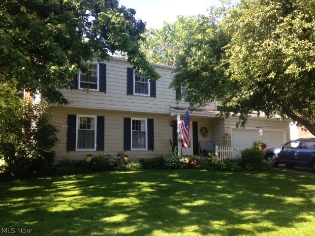 The white picket fence welcomes you to this beautiful, well maintained and updated colonial. The foyer opens into the spacious family room with newer carpet, fireplace and picture window overlooking the manicured and landscaped back yard. The kitchen features solid maple cabinetry and built in stainless steel appliances that include dishwasher 2015, electric cook top 2009, oven 2012 and microwave 2013. Beautiful granite look laminate counter top enhances the kitchen with breakfast bar for quick meals or snacks. Walk out to the deck or enclosed screened porch perfect for those backyard barbeques complete with fire pit and basketball court. Formal living and dining room with beautiful wood floors and remodeled half bath finish off the first floor. Upstairs finds the spacious master with his and her closets, wood flooring and remodeled full bath with step in shower. Three more spacious bedrooms with ample closets for additional storage. The updated main bath features an updated tub/sho