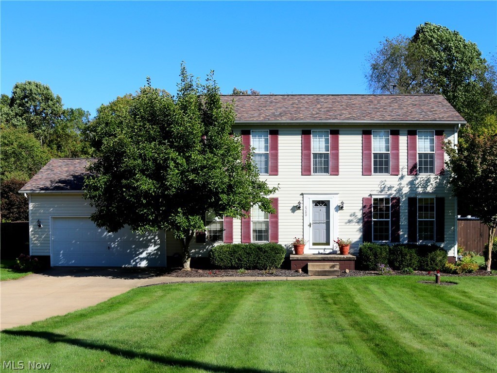 These meticulous owners have a pride of home ownership and it shows in this beauty. As you approach, you'll appreciate the stunning curb appeal featuring a manicured lawn w/ updated landscaping & lighting to accentuate it. Enter through the foyer with ceramic floors to the Eat-in kitchen w/ pantry, white crown molding & updated light fixtures. Dinette opens to huge great room w/ stone gas fireplace & stunning white crown molding. Formal dining room w/ wood laminate floor & bright white crown molding & woodwork. Spacious master suite w/ newer fan, white crown molding & walk-in closet. Loft area upstairs is perfect for an office or den area. Partially finished basement features over 850 sq.ft. of carpeted area w/ un-finished walls. Absolutely huge, private backyard fenced-in w/ over 600 ft. of dog-eared wood fencing w/ large gated opening. Freshly stained deck overlooks a paver patio and stunning backyard filled w/ tons of perennials, large storage shed (that was replaced to the studs) &