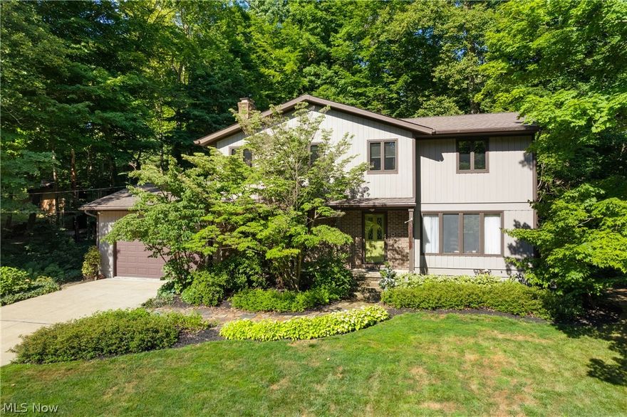 Welcome to this hidden gem in the heart of Copley! As a deeded member of Bluebird Lake, this property offers exclusive access to a stunning lake perfect for swimming and fishing, as well as a playground, basketball and sand volleyball courts, and a community pavilion! Step inside to a welcoming foyer that leads to a spacious living room and dining room combo, featuring large windows that flood the space with natural light. The inviting family room boasts a floor-to-ceiling brick fireplace, flanked by custom built-in shelving, creating a cozy ambiance. The well-appointed kitchen presents extensive cabinetry, a center island, a peninsula breakfast bar, and a planning station. The vaulted great room is a true showstopper, with walls of windows offering panoramic views of the wooded backdrop, skylights, and access to the patio. Convenience abounds with a 1st-floor laundry room and a 1/2 bathroom. The gracious owner’s suite includes an ensuite bathroom with a soaking tub and separate shower. A 2nd bedroom also features an ensuite bathroom with ample storage space. Two additional bedrooms and a full bathroom complete the 2nd level. The finished basement is perfect for entertaining, with a wet bar overlooking a recreation area and a full bathroom!  Outside, the enchanting backyard oasis features a private patio, large shed, and mature trees, all on a .52-acre lot. Pull into the 2-car attached garage or stay parked in the large driveway. Plus, this house has all of the big ticket items already complete with a new roof in '20, new Furnace& AC in '22, new Dishwasher in '22, oven in '20 and a new hot water tank in '21. The 2nd floor addition was completed in 2000 with many new Pella windows replaced at that time or during other remodel jobs. Located in the desirable Copley-Fairlawn district, this home is a must-see! You won’t want to miss this opportunity to own a home within this close-knit neighborhood, who value the importance of outdoor recreation and a sense of community!