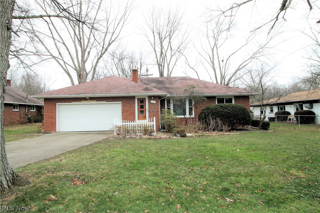 Nothing to do but move into this charming three-bedroom, one-half bath brick ranch home. As you enter into the inviting large family room it offers a wood burning fireplace, wood flooring throughout the home and is open to the stunning, dining room which has built in shelves and cabinets, and doors leading to the beautiful, back deck where you can sit out and enjoy. The bright eat in kitchen offers so many cabinets which have pull out drawers, electric flat top stove, built in oven, refrigerator, ceiling fan and plenty of room for a table and chairs or an island etc. To finish the main level there are three bedrooms, a full large bathroom and half bath. There are endless possibilities that you can do with this large, finished basement offering a wood burning fireplace, just so much room for work out area, office, etc, the basement is waterproofed, glass block, has new faucets, laundry area with utility sink. WOW! There is a two-car attached garage, storage area in the attic above the g