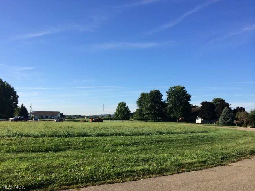 Hillview Subdivision is one of the best building sites available in Tuscarawas County. This amazingly flat lot is just "a hair" under 1 acre coming in at .934 acres. The frontage is approximately 285x150- perfect for that "rambling ranch" plan or your impressive 2 story home. Unbelievable views, exceptional lot size, great soil for building, and best of all "no city taxes" to pay. A circular plotted subdivision with wide streets, gracious entryway, and beautiful neighboring homes. Buyer responsible to drill own private well and septic. Typical well depths around 60 feet.