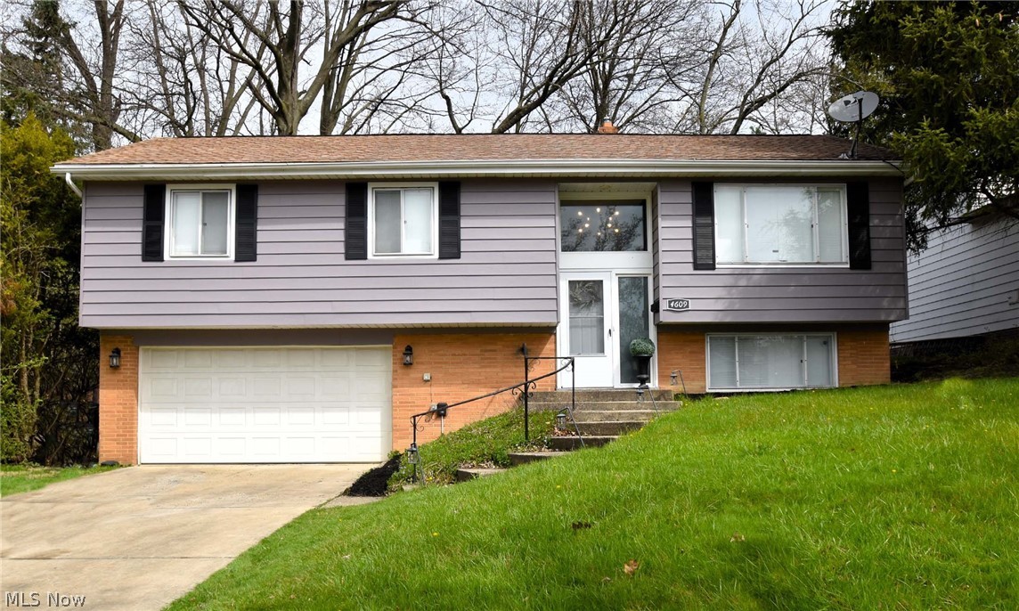 A MUST SEE!! Beautiful home with an open concept, hardwood floors throughout and vaulted ceilings that has been lovingly maintained. It boasts 3 generous in size bedrooms and 2 nicely updated full bathrooms. The kitchen has custom white cabinets, a beautiful farmhouse sink and granite countertops opening to the dining area which leads to the great room. The lower level is completely finished and has a full bathroom as well as a bonus/rec room for kids or a secondary family room space. Tons of storage space! There is a 2 car attached garage! This home sits on a double lot, on a quiet street with a wonderful private backyard that is partially wooded with a nice deck. Sellers are including a home warranty which adds peace of mind for the lucky buyers! Close to tons of shops, restaurants, grocery stores, legacy village, and easy access to the freeway! A quick ride to downtown and major hospitals as well! Move in ready!!! Hurry, this home won't last long!!