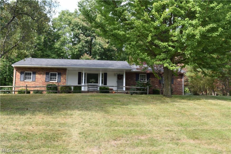 Original owners of this immaculate 3 bedroom, 2 bath ranch with lovely sun room addition with wood burner, vaulted wood ceiling. This home includes a second parcel of 1.09 acres. Beautiful brick patio for outdoor entertainment. Park like setting. Partially finished rec room with bar.